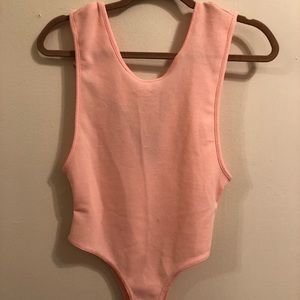 Coral body suit.